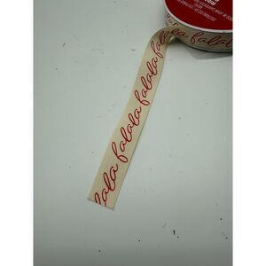 Decorative holiday ribbon  featuring the phrase " falala "